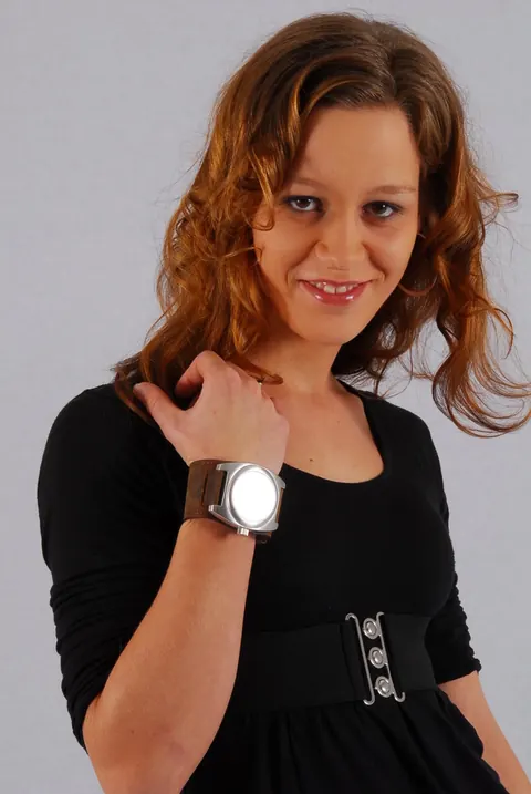 Redhead in a Skirt Over Jeans Poses with a Cuff Watch – photo 1 of 16
