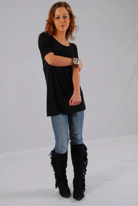 Redhead in a Skirt Over Jeans Poses with a Cuff Watch – photo 15 of 16