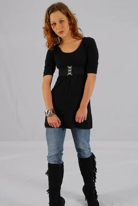 Redhead in a Skirt Over Jeans Poses with a Cuff Watch – photo 11 of 16
