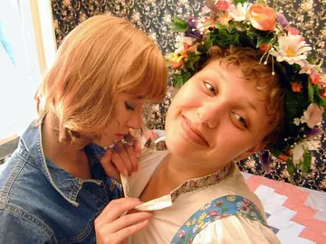 Short-Haired Curly Babe Uses a Dildo in Lesbian Sex