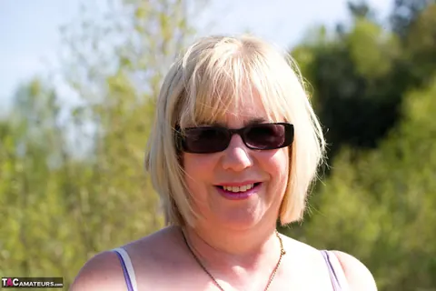 Blonde BBW Strips Out of Her Bikini in the Garden – photo 1 of 16