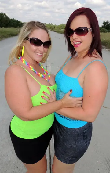 Dee Siren – Mature Blonde and Brunette in Glasses Fist and Lick Outdoors