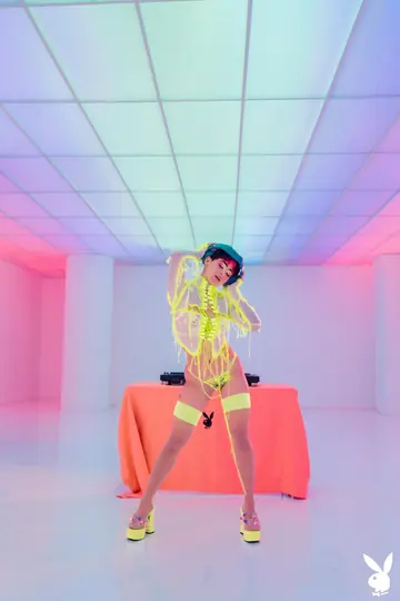Tall Blonde with Short Hair Poses in a Fluorescent Outfit