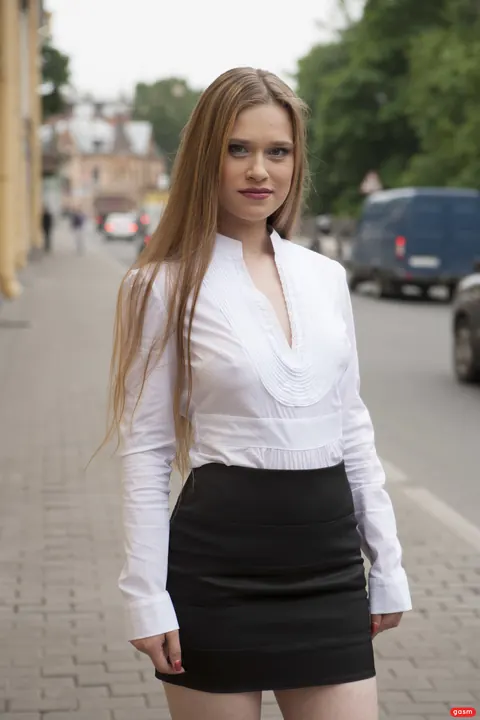 Augustina: German Brunette Poses in a Miniskirt and Heels Outdoors by a Car – photo 8 of 15