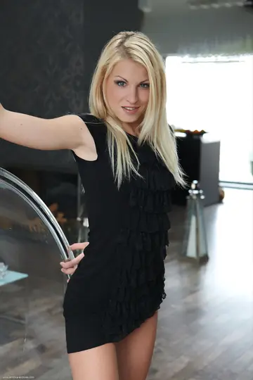 Blonde Model Strips Nude and Poses in the Light