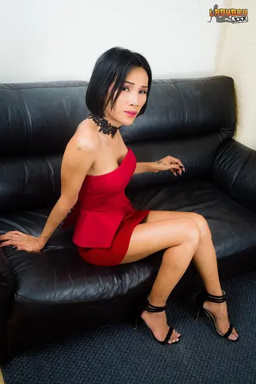 Asian Trans Woman Spreads Her Legs and Shows Cock in a Skirt