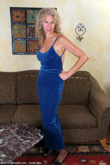 Mature Blonde Strips Out of Her Panties and Fingers Her Pussy