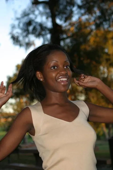 African Brunette Shows Her Breasts and Dark Nipples Outdoors – photo 11 of 20