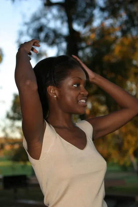 African Brunette Shows Her Breasts and Dark Nipples Outdoors – photo 13 of 20