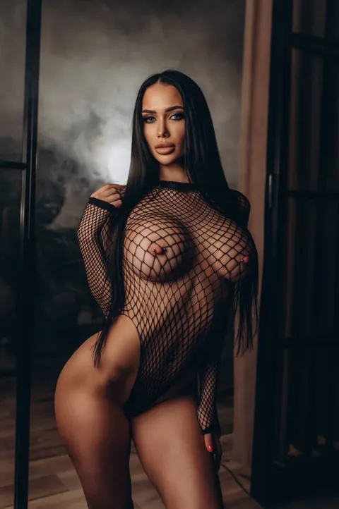 Thick Brunette in Fishnet Shows Off Her Big Pierced Tits and Ass – photo 6 of 10
