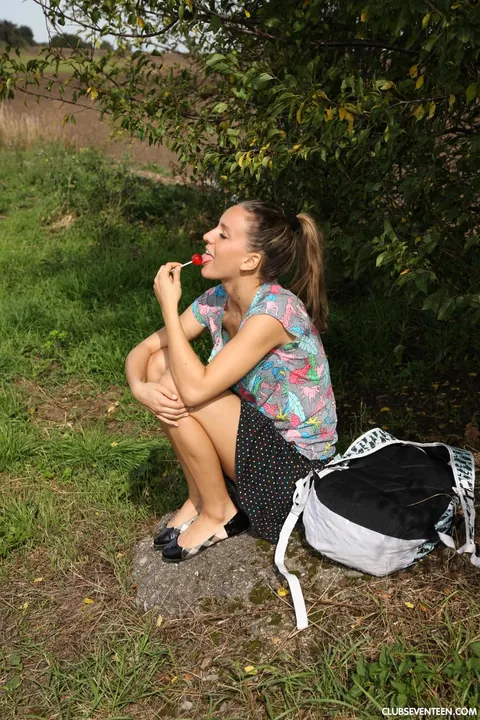 European Woman Teases with Lollipop Outdoors – photo 3 of 21