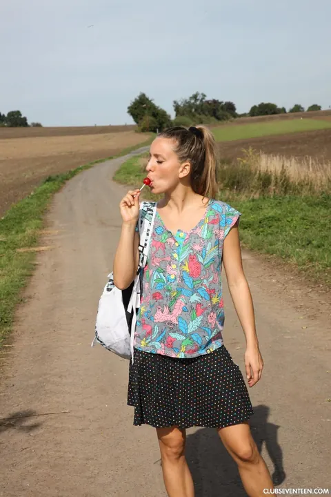 European Woman Teases with Lollipop Outdoors – photo 2 of 21