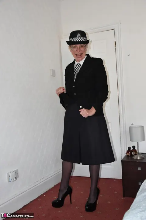 Busty British MILF in a Police Uniform Fingers and Spreads Her Pussy – photo 2 of 16