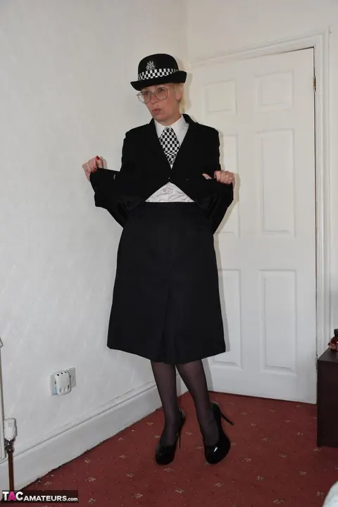 Busty British MILF in a Police Uniform Fingers and Spreads Her Pussy – photo 3 of 16