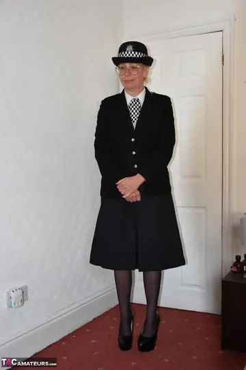 Busty British MILF in a Police Uniform Fingers and Spreads Her Pussy