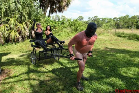 Esmi Lee: Two Mature Athletic Women Dominate a Nude Submissive Outdoors – photo 12 of 15