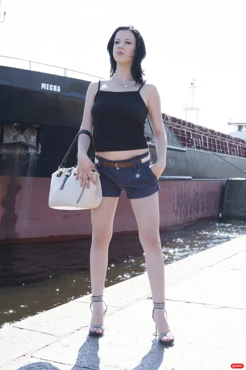 German Brunette Poses in Shorts and High Heels – photo 8 of 15