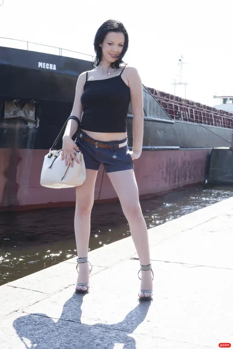 German Brunette Poses in Shorts and High Heels – photo 12 of 15