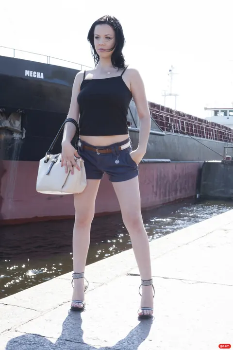 German Brunette Poses in Shorts and High Heels – photo 9 of 15