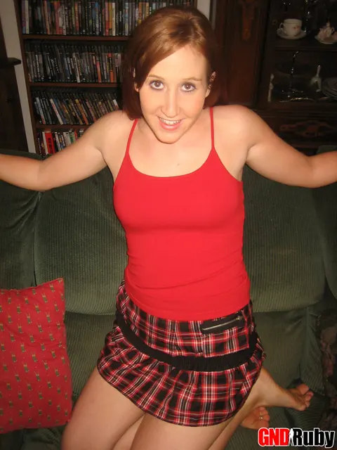 Redhead Lifts Her Skirt and Spreads on the Sofa – photo 2 of 12