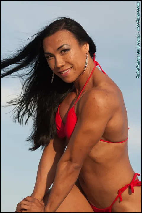 Tram Nguyen: Brunette Asian MILF Flexes in a Red Bikini on the Beach – photo 12 of 15