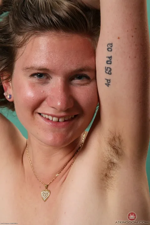 Hairy Woman Undresses and Poses on the Bed – photo 18 of 21