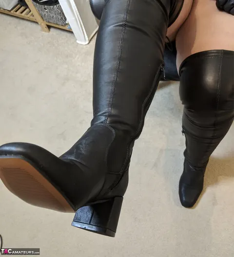 Curvy Mature Redhead in Leather and Latex Spreads Her Shaved Pussy – photo 10 of 19