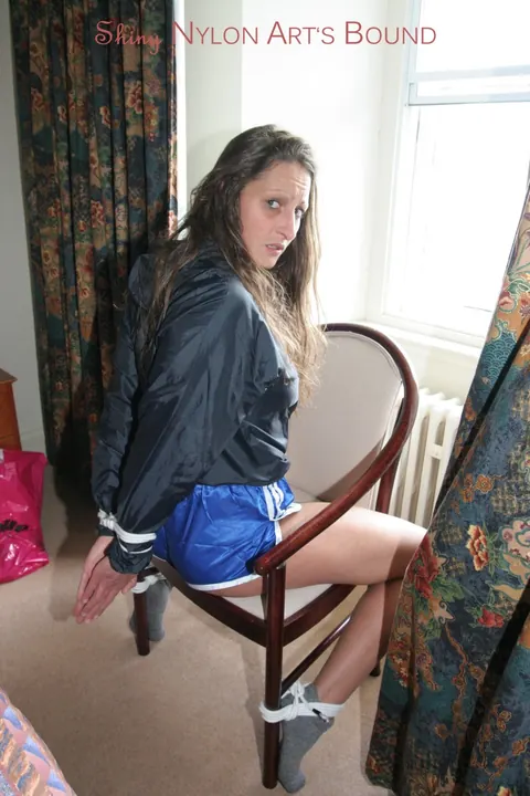 Brunette in Shorts Removes Gag While Tied Up – photo 7 of 16