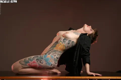 Michelle Aston: Tattooed Brunette MILF Strips Nude and Poses – photo 1 of 15