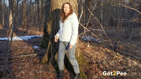 Nikky B: European Brunette in Jeans and Boots Poses Outdoors by a Tree – photo 2 of 15
