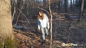 Nikky B – European Brunette in Jeans and Boots Poses Outdoors by a Tree