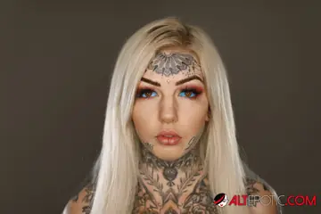 Tattooed Blonde Strips Out of Her Lingerie and Thong to Show Her Inked Body