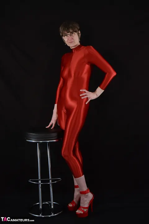 Mature PAWG in Glasses Unzips Her Catsuit and Shows Off Her Body – photo 1 of 16