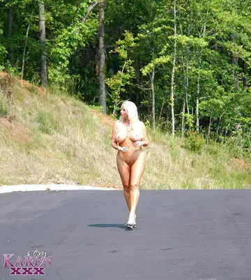 Karen Fisher – Mature PAWG Fingers Her Shaved Pussy on a Paved Road