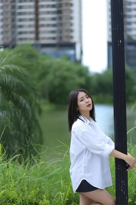 Asian Woman Strips Out of Her Shorts and Top Outdoors – photo 7 of 21