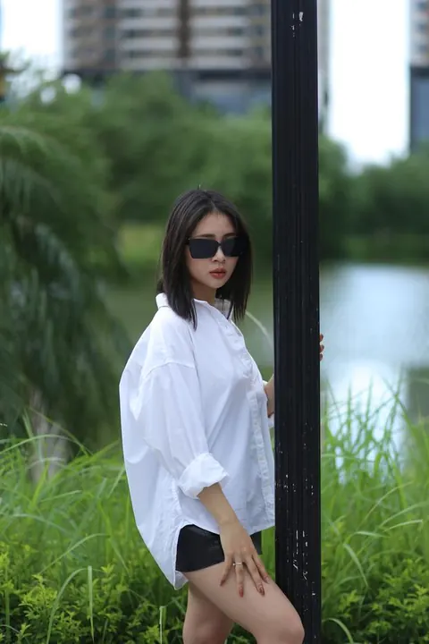 Asian Woman Strips Out of Her Shorts and Top Outdoors – photo 21 of 21