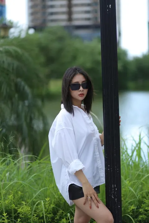 Asian Woman Strips Out of Her Shorts and Top Outdoors – photo 1 of 21