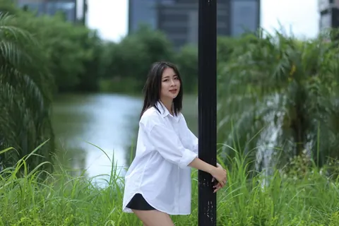Asian Woman Strips Out of Her Shorts and Top Outdoors – photo 8 of 21