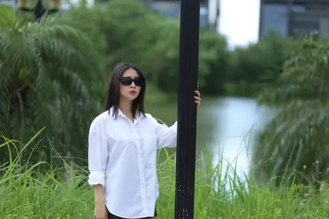 Asian Woman Strips Out of Her Shorts and Top Outdoors – photo 5 of 21
