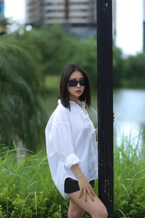 Asian Woman Strips Out of Her Shorts and Top Outdoors – photo 2 of 21