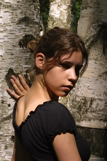 Petite Slim Woman Poses Nude in the Forest
