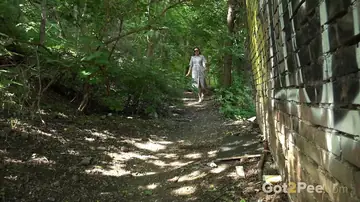 Julia North – Mature Brunette in a Skirt and Glasses Spreads on a Forest Path