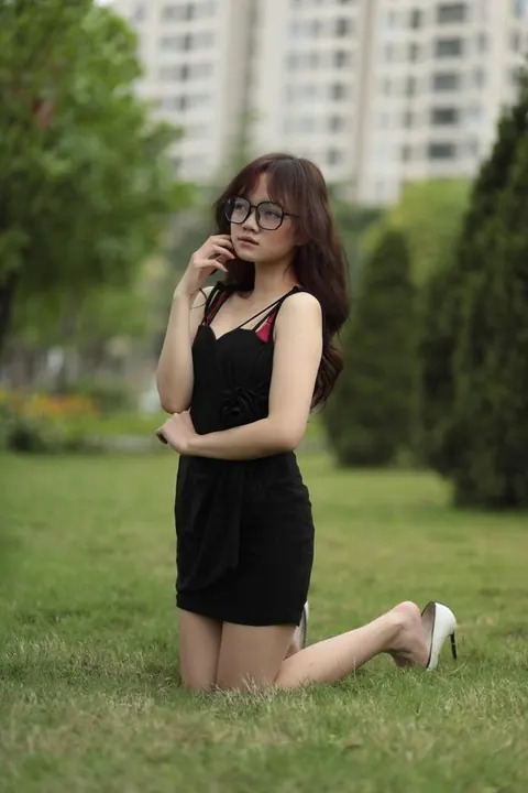 Pale Asian Redhead Poses in a Dress and Heels Outdoors – photo 7 of 21