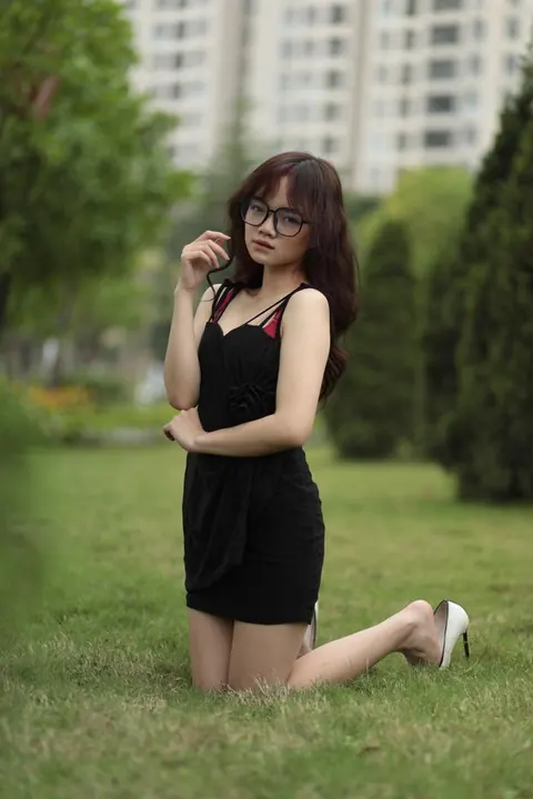Pale Asian Redhead Poses in a Dress and Heels Outdoors – photo 10 of 21