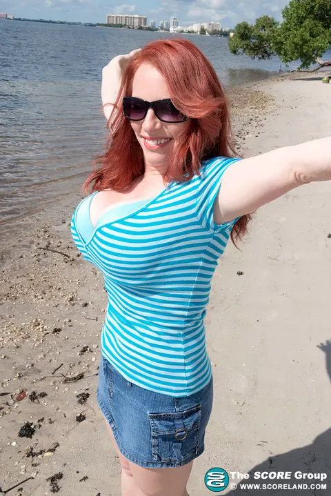 Red Vixen: Redhead Reveals Her Big Enhanced Tits in a Bikini Outdoors – photo 3 of 16