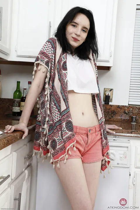 Lily Moon: Petite Brunette in Shorts Spreads Her Shaved Holes in the Kitchen – photo 2 of 20