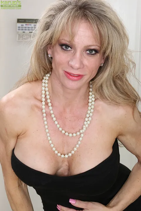 Christina Brim: Mature Blonde Strips and Masturbates with Her Legs Spread – photo 1 of 16