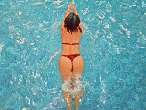 Thick Brunette Flaunts Her Big Ass in a Bikini by the Pool – photo 8 of 15