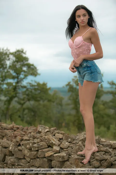 European Brunette Strips Nude Outdoors by a Stone Wall – photo 2 of 16