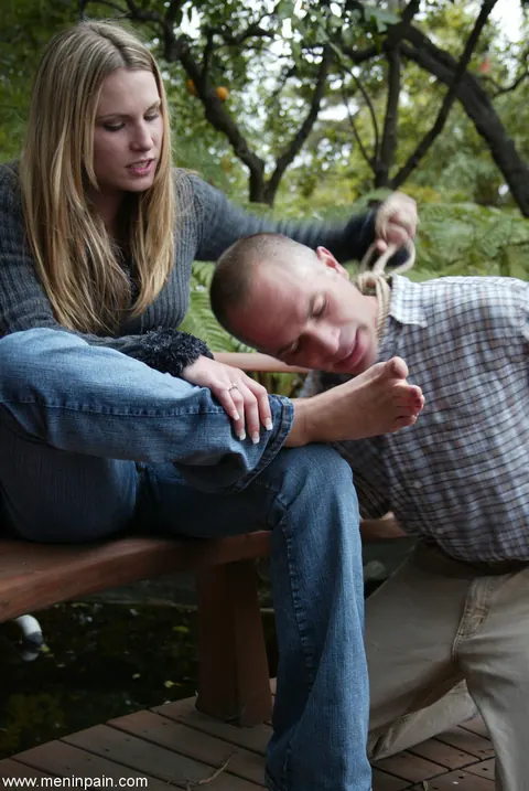 Blonde Dominatrix Controls Bound Man in Jeans Outdoors – photo 13 of 17